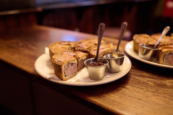 Devour London Historical Pub Tour:Traditional British Food & Ales - Ye Olde Mitre (1546): pork pie and London Pride in a time-warp pub room