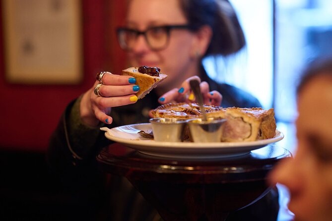 Devour London Historical Pub Tour:Traditional British Food & Ales - Ye Olde Cock Tavern on the Thames: scotch egg, portobello ale, and shuffleboard fun