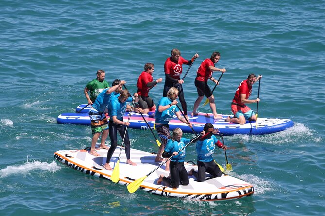 Giant Stand Up Paddle Boarding Experience in Newquay - Giant SUP in Newquay Bay, not your typical calm lake paddle