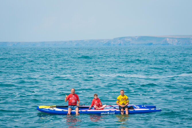 Giant Stand Up Paddle Boarding Experience in Newquay - The “two coves” style adventure, caves, calmer water, and possible swim time