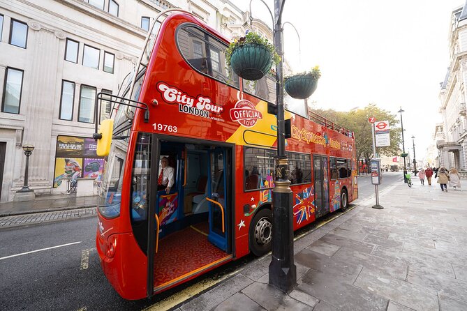 London Tour Hop-on Hop-off Bus with Optional Thames River cruise - Top-deck riding and onboard comfort, headphones included