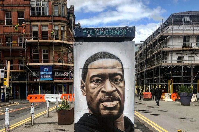 Manchester Private Tour with a Local - Highlights & Hidden Gems - Chinatown under an ornate arch, then a Victorian market hall food stop