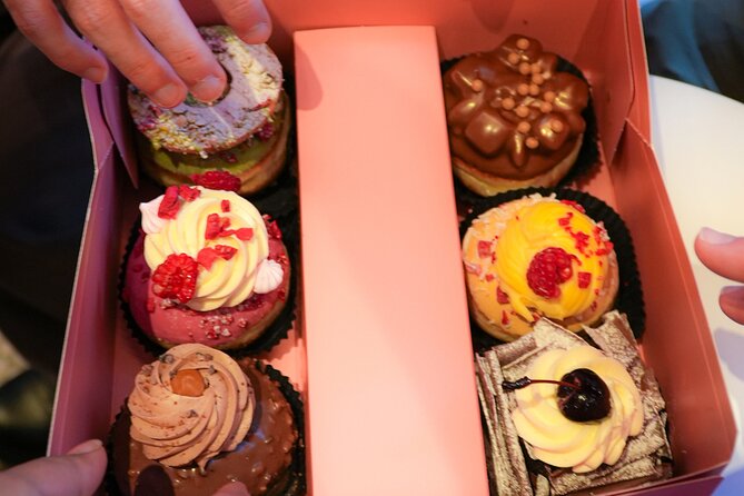 West End Donut Adventure Sweets and Sights in London - Seven Dials and the monument stop that breaks up the eating